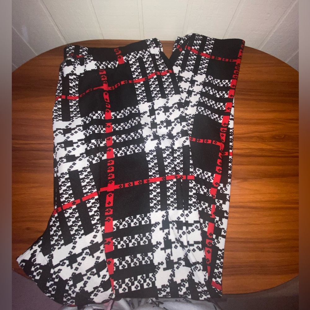 Black and white plaid pants with red and white accents